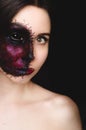Creepy portrait of a woman with a cursed mark on her face on dark background Royalty Free Stock Photo