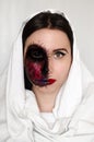Creepy portrait of a woman with a cursed mark on her face on white background