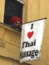 Creepy scary eye-catching commercial marketing with a clown for a Thai massage studio in Praha