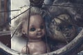 Creepy sinister old broken dirty abandoned dolls as halloween concept