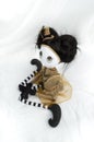 Creepy steampunk doll sitting, kneeling. High angle view.