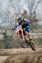 Crema, Italy Ã¢â¬â 12/2022: Motocross bike performing stunts on training track