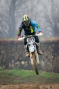 Crema, Italy Ã¢â¬â 12/2022: Motocross bike performing stunts on training track