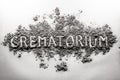 Crematorium, crematory word written in ash, dust cloud