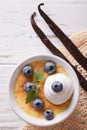 Creme brulee dessert with blueberries closeup. vertical top view Royalty Free Stock Photo