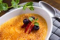 Creme Brulee Dessert with Caramelised Sugar, Strawberry, Blueberry and Fresh Mint Leaves Royalty Free Stock Photo