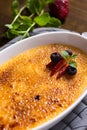 Creme Brulee Dessert with Caramelised Sugar, Strawberry, Blueberry and Fresh Mint Leaves Royalty Free Stock Photo