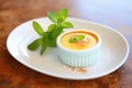 creme brulee with mint leaf garnish Royalty Free Stock Photo