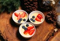 Creme brulee portions with fresh blueberries and strawberries