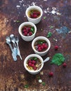 Creme brulees with raspberries and mint in white Royalty Free Stock Photo