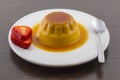 Creme caramel vanilla custard dessert or flan on white dish with Royalty Free Stock Photo