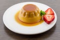 Creme caramel vanilla custard dessert or flan on white dish with Royalty Free Stock Photo