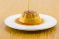 Creme caramel vanilla custard dessert or flan on white dish Royalty Free Stock Photo