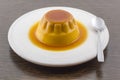 Creme caramel vanilla custard dessert or flan on white dish Royalty Free Stock Photo