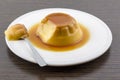 Creme caramel vanilla custard dessert or flan on white dish Royalty Free Stock Photo