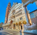 Cremona Cathedral behind the stone lion, Italy