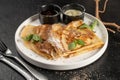 Crepe with berry sauce, mint and chia seeds. Classic hot breakfast. Royalty Free Stock Photo