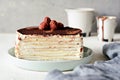 Crepe cake made of thin Crepe with butter cream, cocoa, chocolate,freeze-dried strawberries.