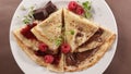 Crepe with chocolate spread and raspberry fruit Royalty Free Stock Photo