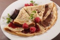 Crepe with chocolate spread and raspberry fruit Royalty Free Stock Photo