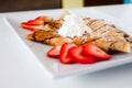 Crepe with fresh strawberries sprinkled with sugar Royalty Free Stock Photo