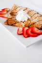 Crepe with fresh strawberries sprinkled with sugar Royalty Free Stock Photo