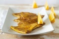 Crepe suzette in caramel sauce on a plate with a slice of orange. French dessert. Royalty Free Stock Photo
