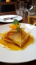 Crepe suzette, tasty pancakes with orange sauce on white plate, AI generative