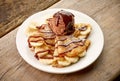 Crepes with banana and chocolat icecream on wooden desk Royalty Free Stock Photo