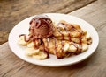 Crepes with banana and chocolat icecream on wooden desk Royalty Free Stock Photo