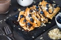 Crepes with blueberries almond flakes and chocolate sauce on black. Royalty Free Stock Photo