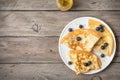 Crepes with blueberries and honey