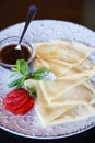 Crepes filled with jam, strawberries close-up Royalty Free Stock Photo