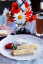 Crepes filled with sour cream and strawberries Royalty Free Stock Photo