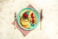 Crepes with fresh berries on rustic wooden background with space for text, top view. Pancake. sweet breakfast. food recipe