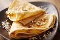 Crepes with honey or syrup and roasted nuts