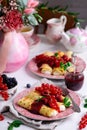 Crepes with lemon cream and raspberry jam. .selective focus