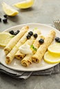 Crepes with lemon filling and blueberries