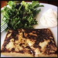 Crepes on plate with salad and sauce