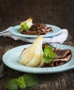 Crepes with poached pear in syrup Royalty Free Stock Photo