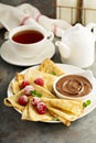 Crepes with raspberry and chocolate sauce