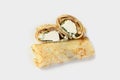 Crepes rolls with cream cheese and greens. One pancake is cut in two to show the filling. food for the delivery service Royalty Free Stock Photo