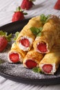 Crepes with strawberries and cream cheese close-up. vertical Royalty Free Stock Photo