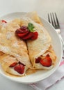 Crepes with strawberry jam and cream Royalty Free Stock Photo