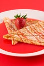 Crepes with strawberry syrup