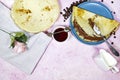 Crepes stuffed with chocolate spread on blue plate with fig jam bowl and coffee beans Royalty Free Stock Photo