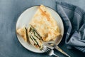 Crepes with stuffed cream cheese, spinach, turkey on plate. Cuisine meal food concept. Top view Royalty Free Stock Photo