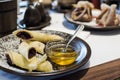 Crepes stuffed with poppy seeds, nuts and honey on plate for breakfast. Delicious pancakes wrapped with poppy seeds Royalty Free Stock Photo