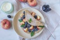 Crepes, thin pancakes or blini with berries Royalty Free Stock Photo