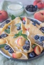 Crepes, thin pancakes or blini with berries Royalty Free Stock Photo